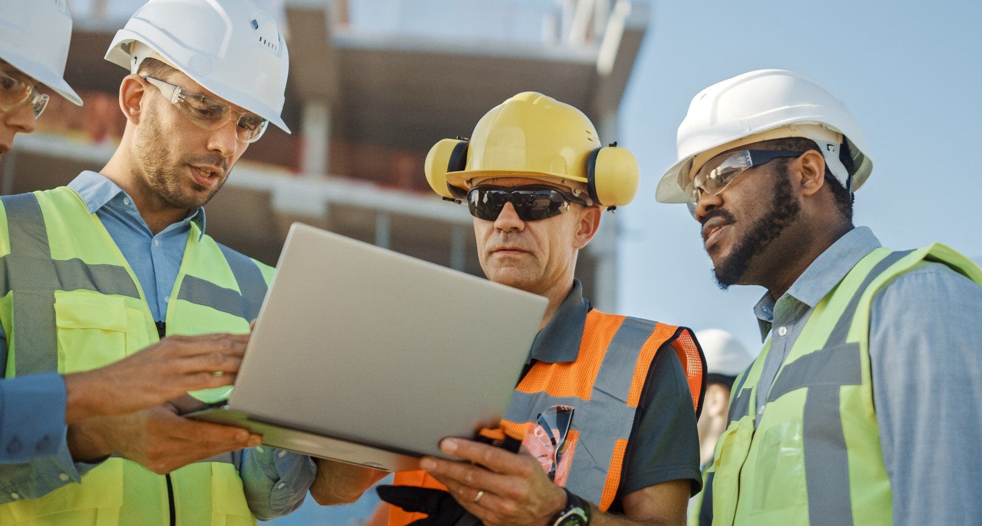 Engineers discussing project at construction site