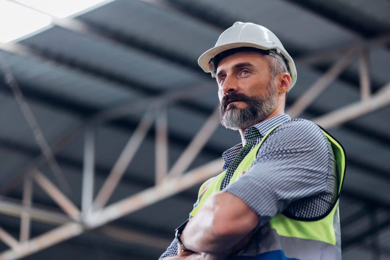 Engineer in helmet inside industrial building