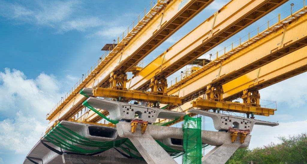 Large cranes building a bridge