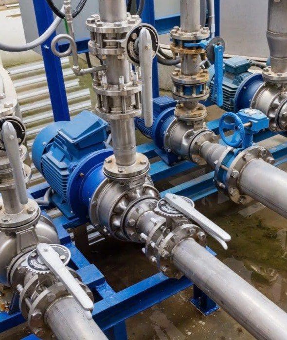 Close-up of connected metal pipes and valves.